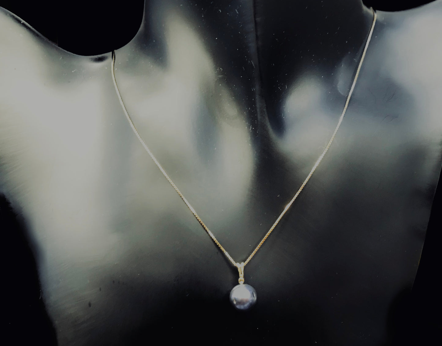 Pearl and diamond pendant
